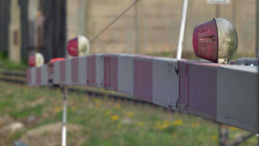 Crossbuck sign at a passive railroad crossing without gates or lights